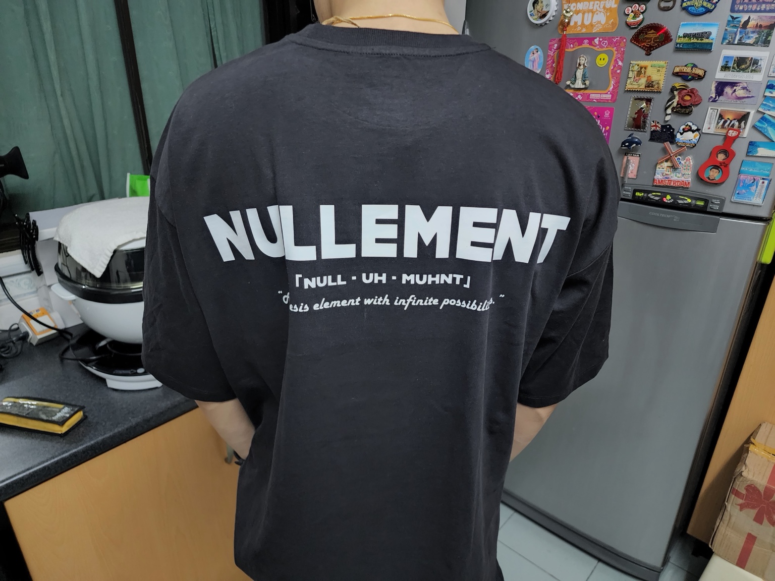 Nullement shirt being worn, showing the original wordmark